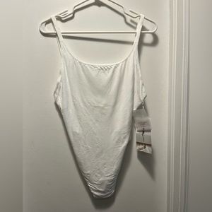 Never worn LuLuLemon Heart Opener Bodysuit in white.